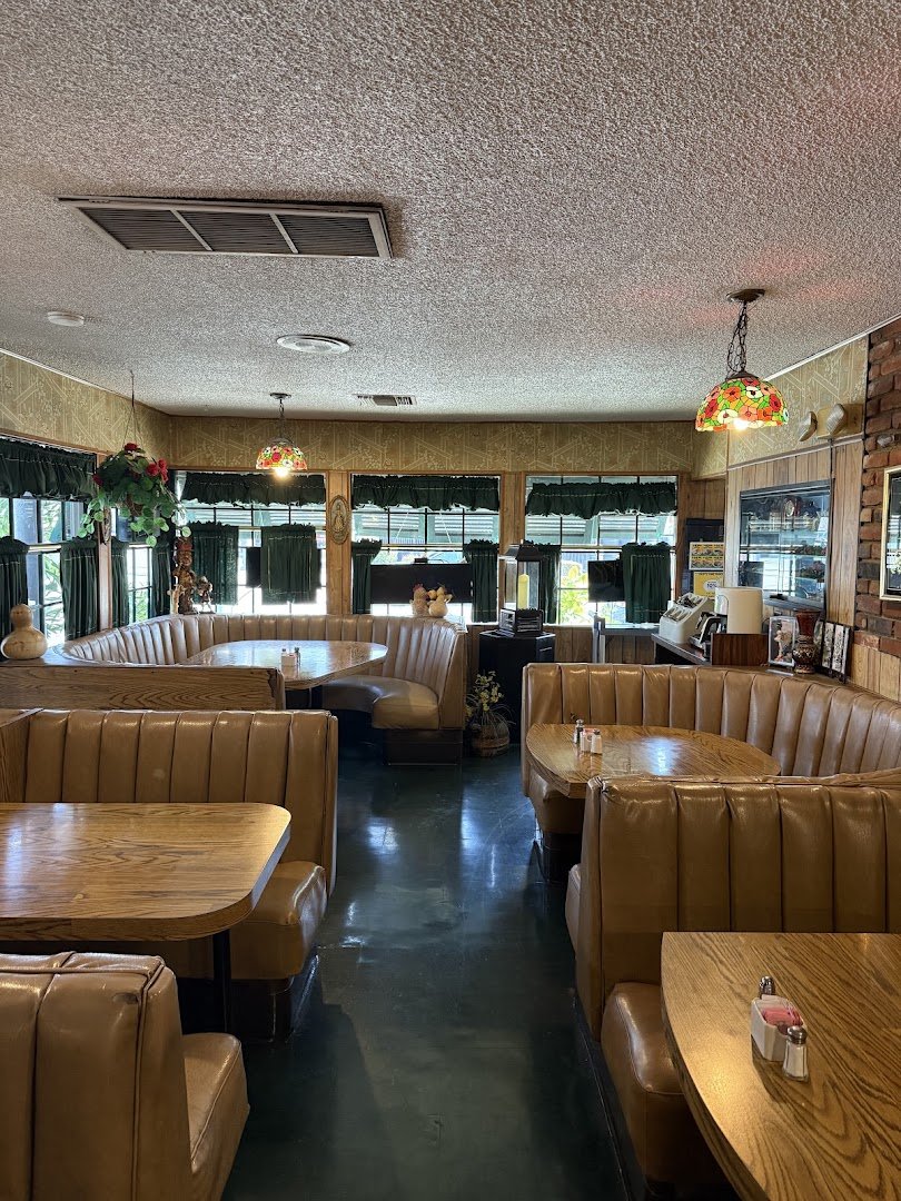 Historic restaurant interior with tables and bar seating.