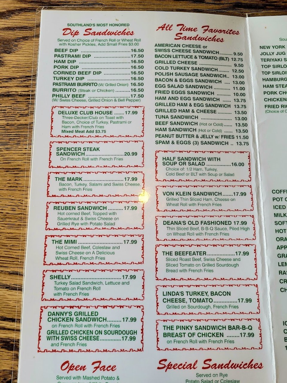 Breakfast menu items beside coffee and juice.
